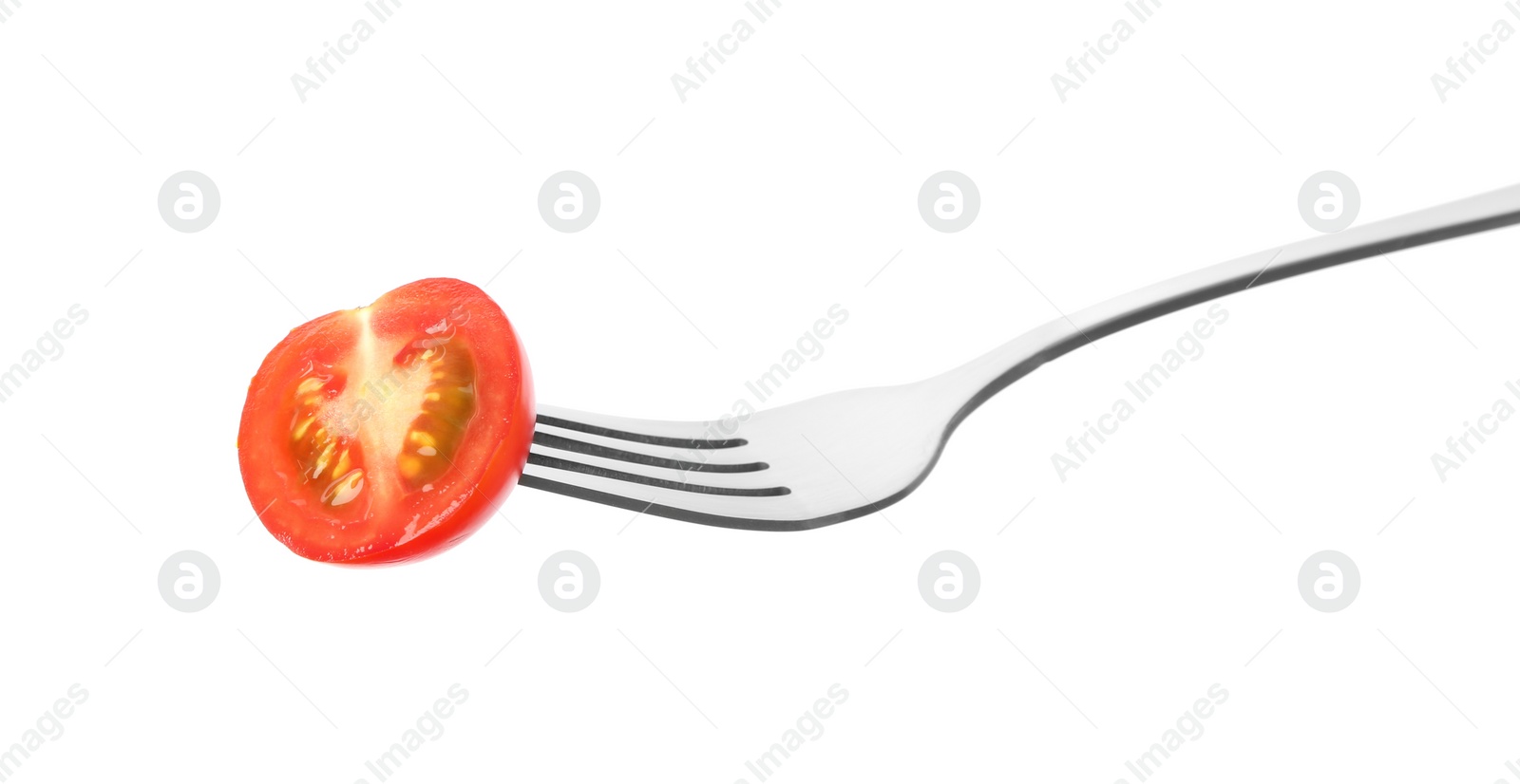 Photo of Fork with half of cherry tomato isolated on white