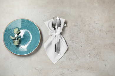 Photo of Setting with beautiful cutlery on textured table, top view. Space for text