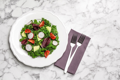 Photo of Delicious kale salad on marble table, flat lay