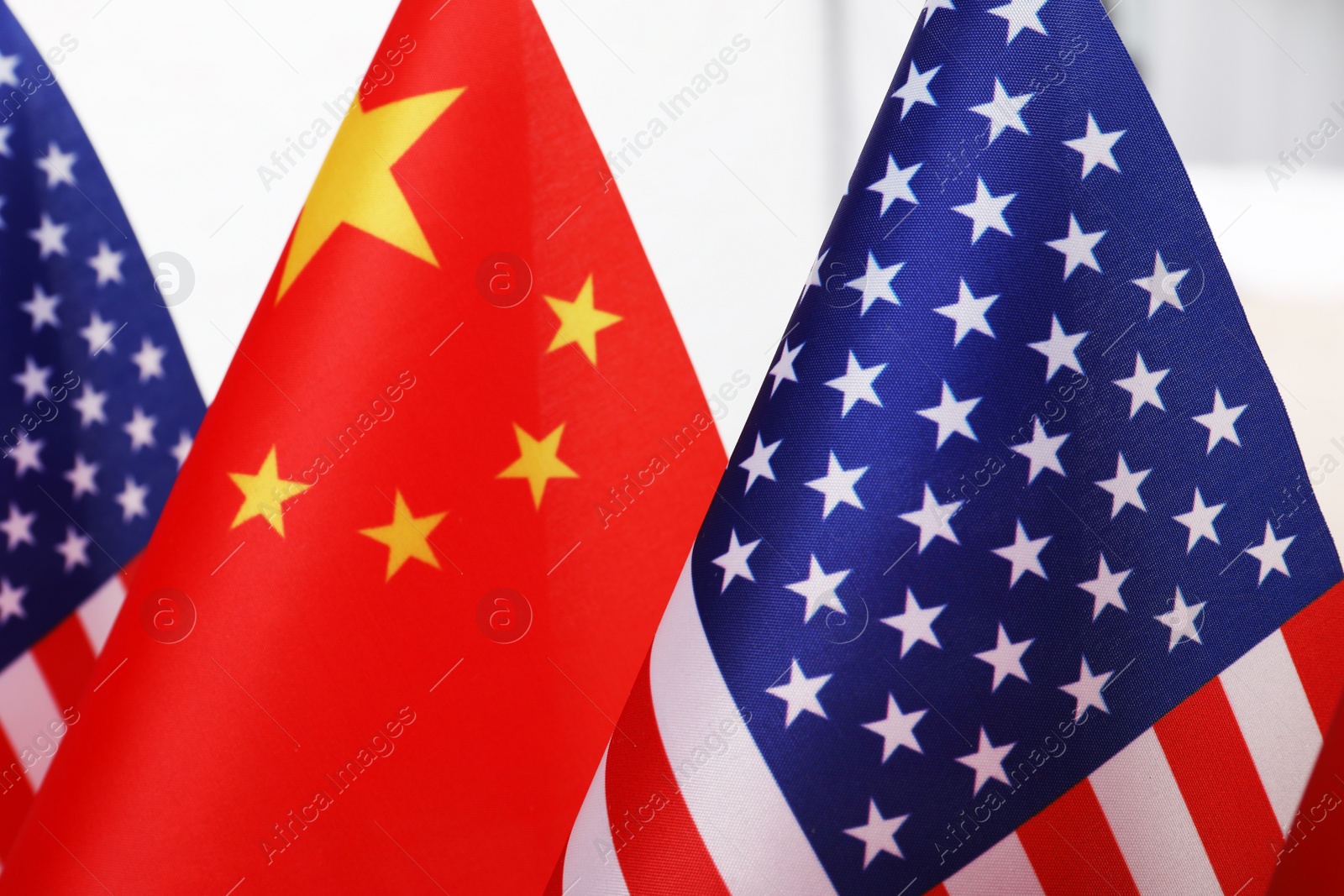 Photo of USA and China flags, closeup. International relations