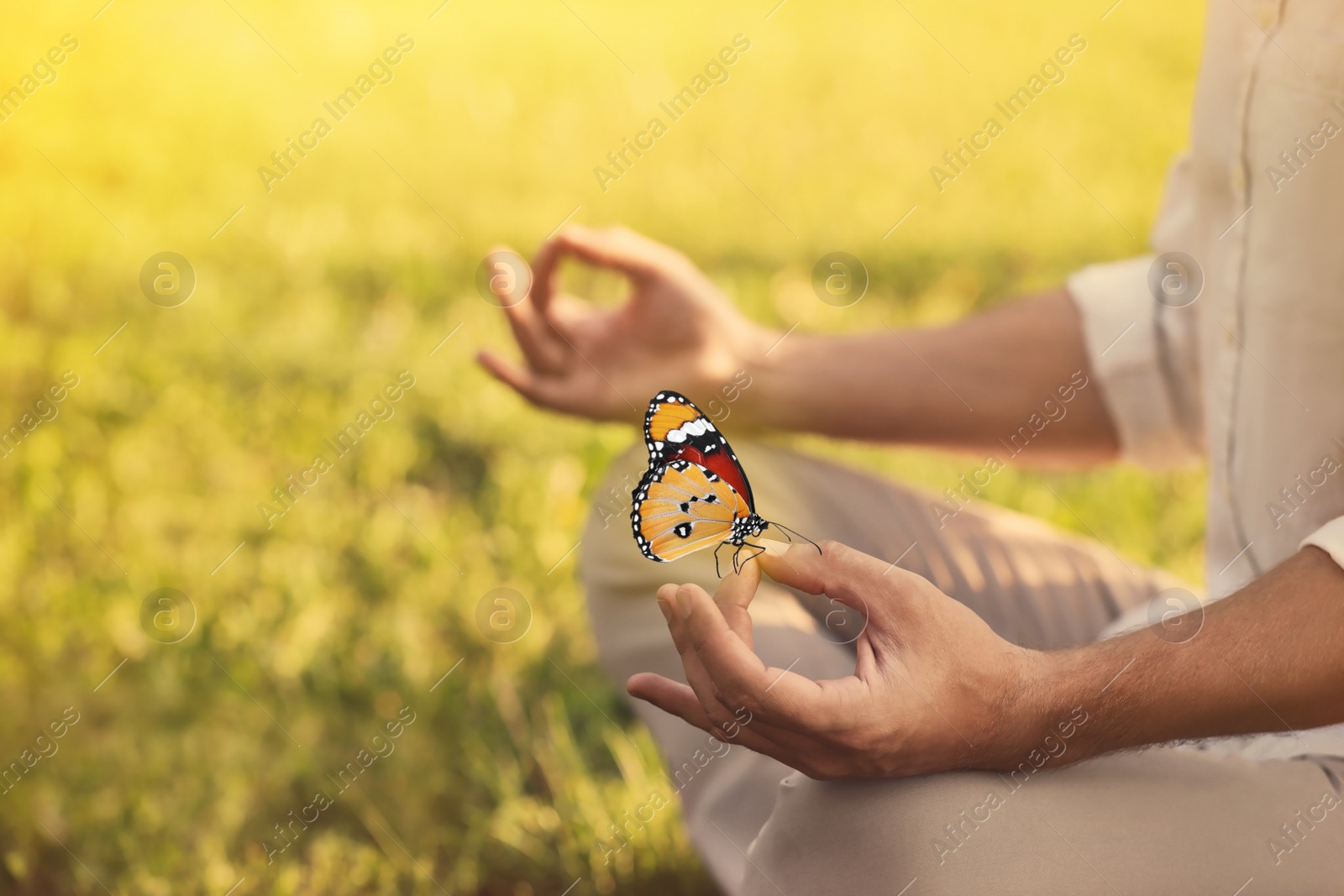 Image of Man meditating outdoors on sunny day, closeup. Space for text