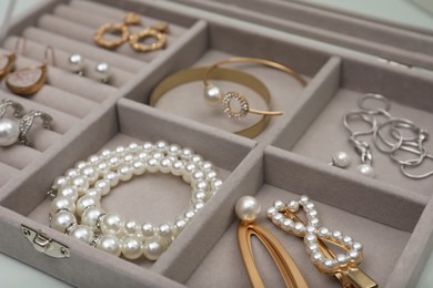 Photo of Box with luxurious pearl jewelry, closeup view