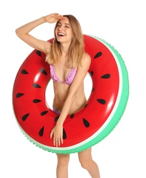 Photo of Beautiful young woman in stylish bikini with watermelon inflatable ring on white background