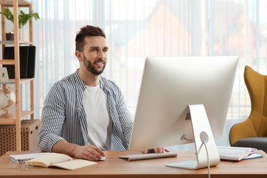 Online test. Man studying with computer at home