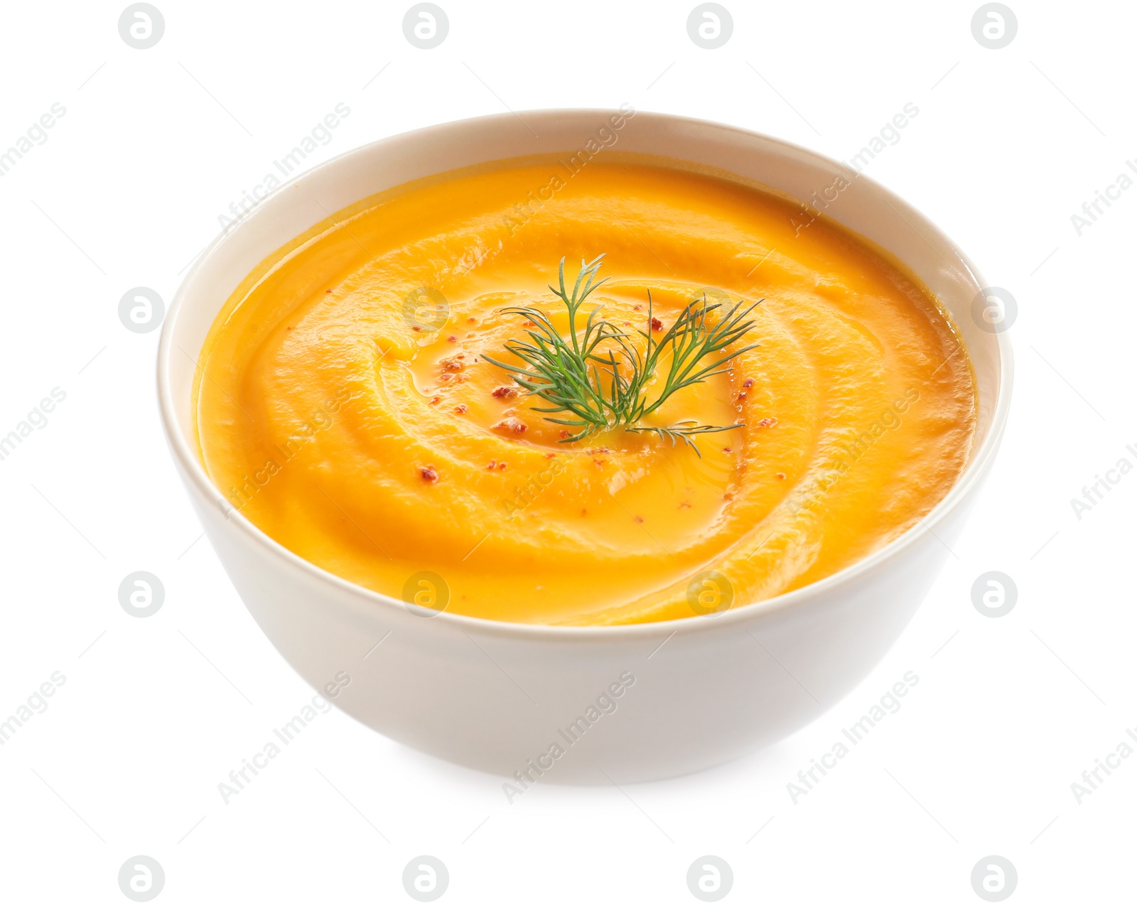 Photo of Delicious pumpkin cream soup in bowl on white background