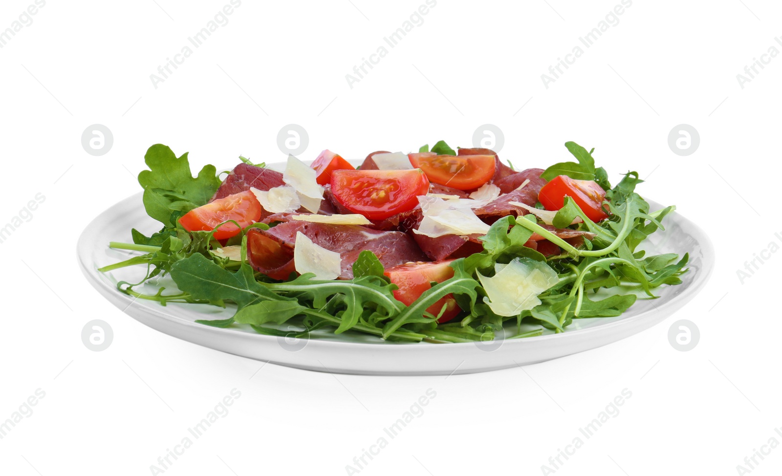 Photo of Delicious bresaola salad with parmesan cheese isolated on white