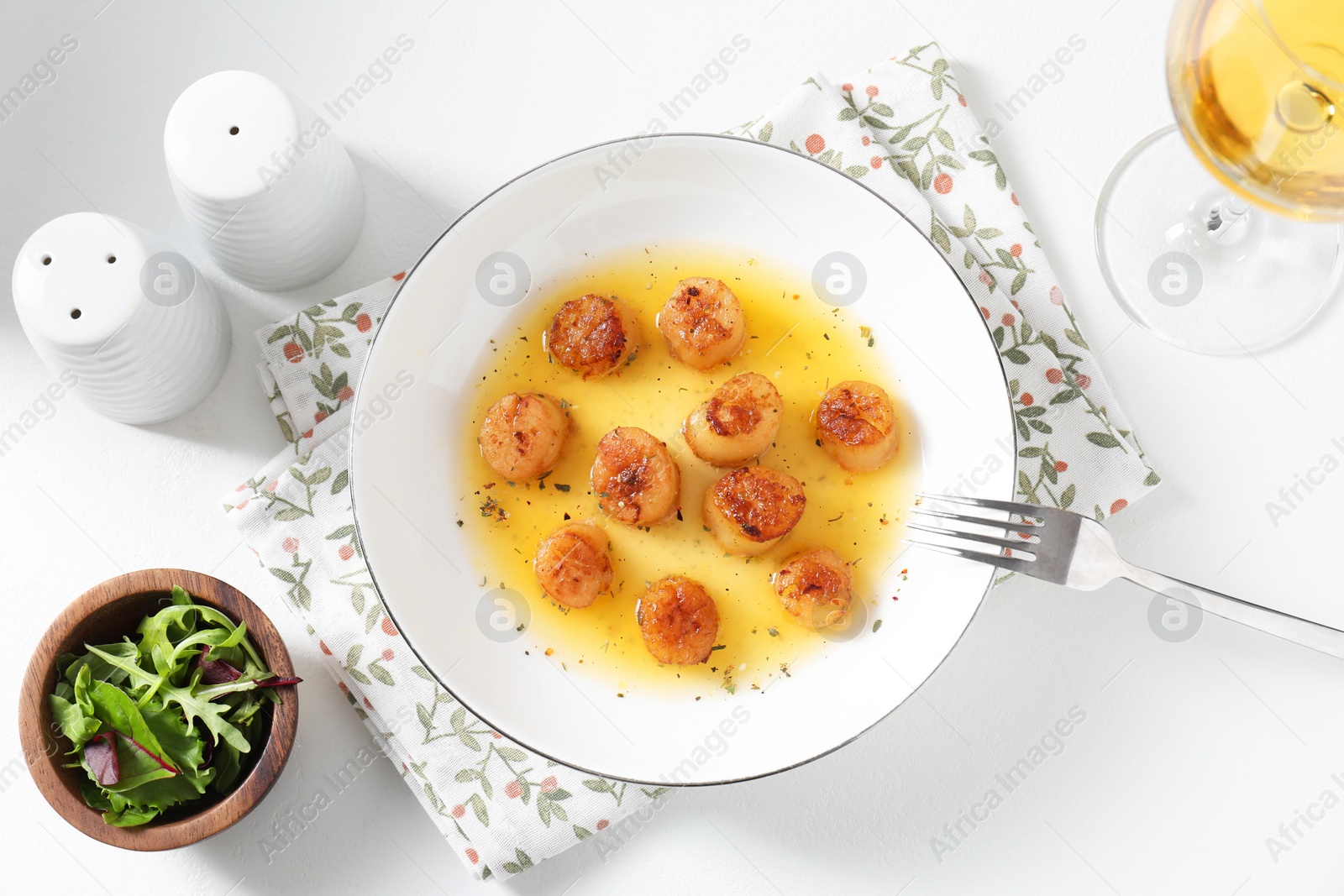 Photo of Delicious fried scallops served on white table, flat lay