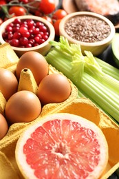 Photo of Grapefruit, eggs, asparagus and other healthy food, closeup