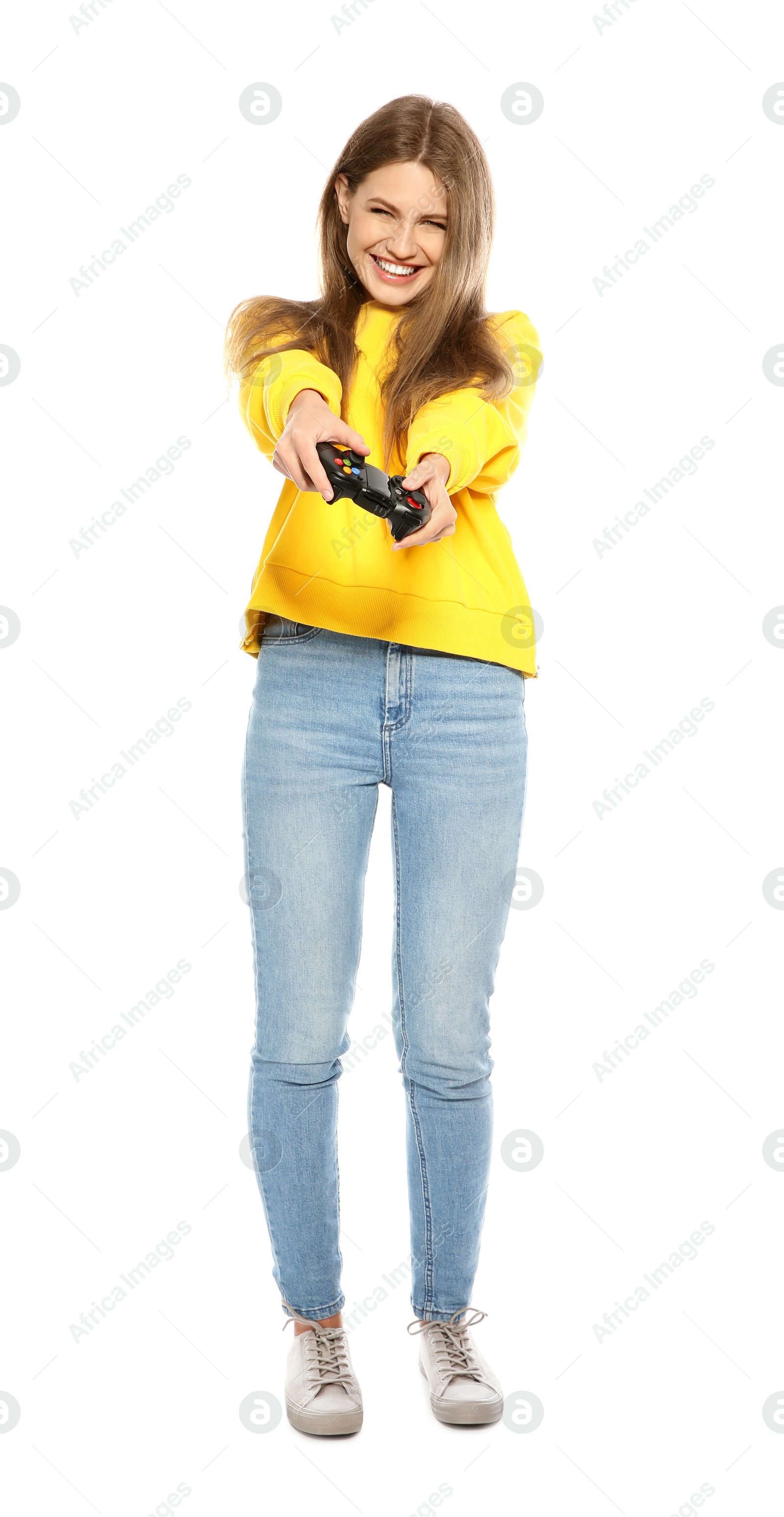 Photo of Emotional young woman playing video games with controller isolated on white