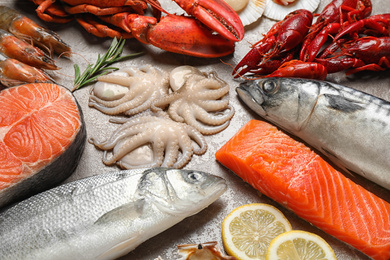 Photo of Fresh fish and seafood on marble table