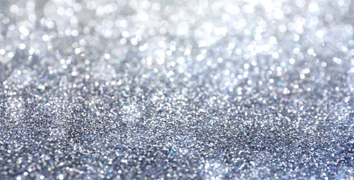 Image of Shiny silver glitter as background. Banner design