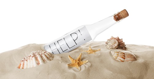 Photo of Corked glass bottle with Help note and seashells on sand against white background