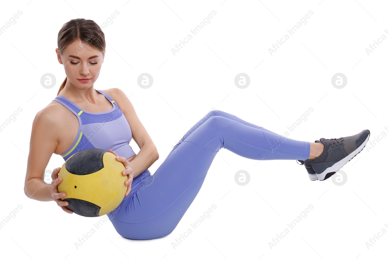 Photo of Athletic woman doing exercise with medicine ball isolated on white