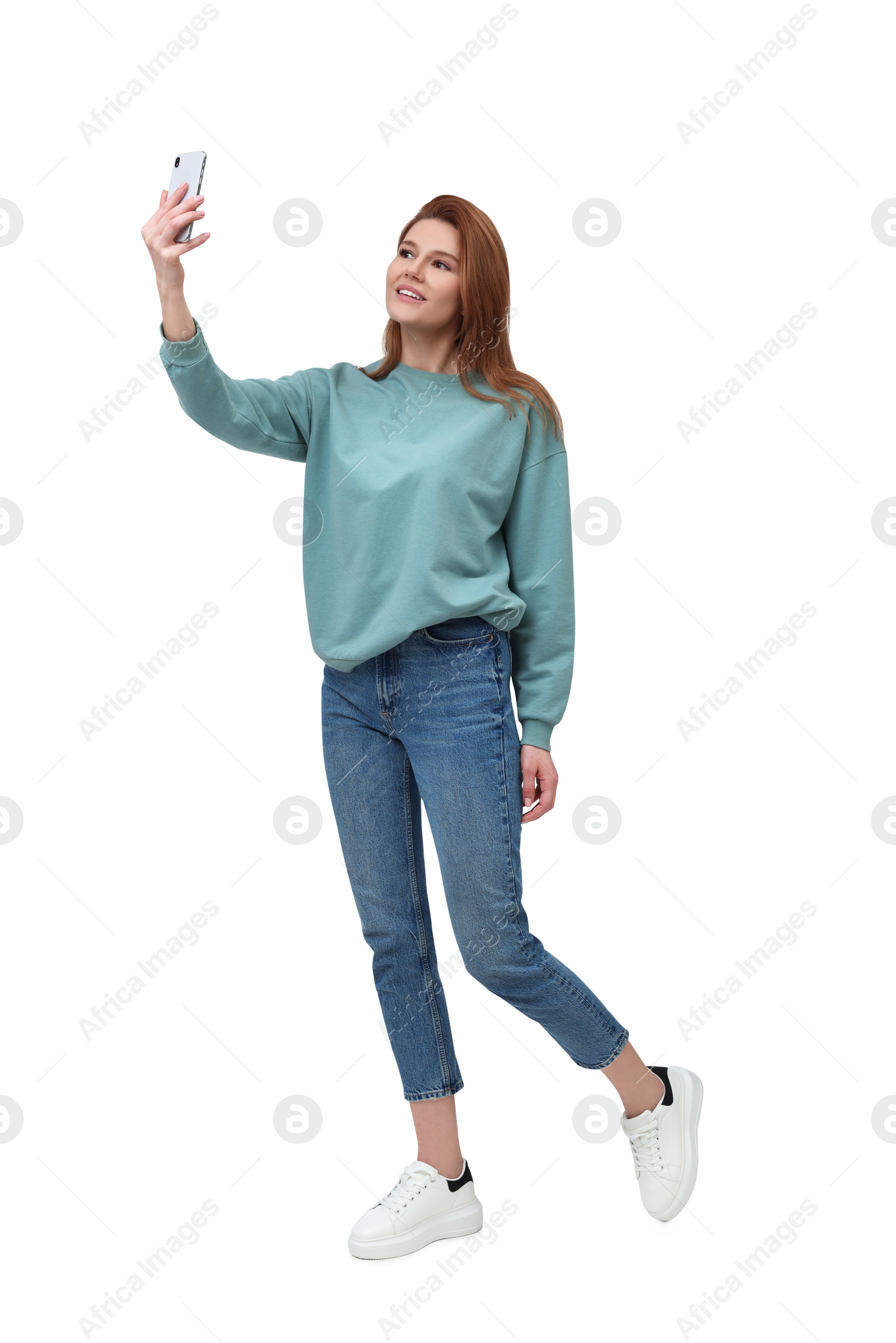 Photo of Beautiful woman taking selfie on white background