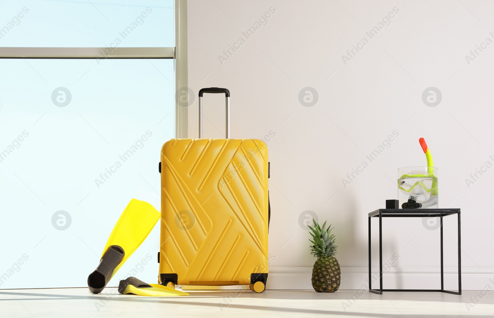 Photo of Large suitcase for travelling and beach items indoors