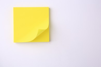 Photo of Blank paper note on white background, top view. Space for text