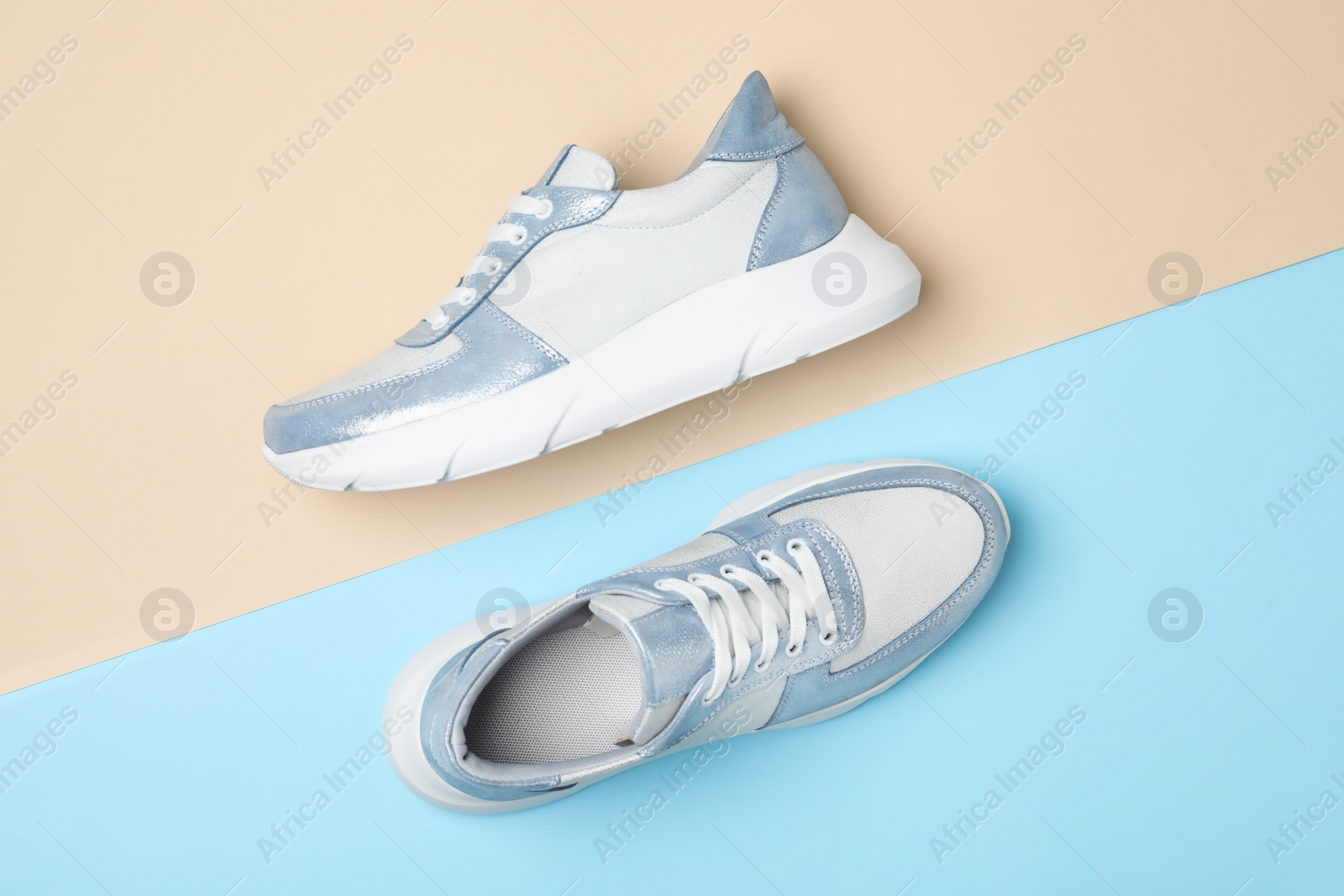 Photo of Stylish shoes on color background, flat lay