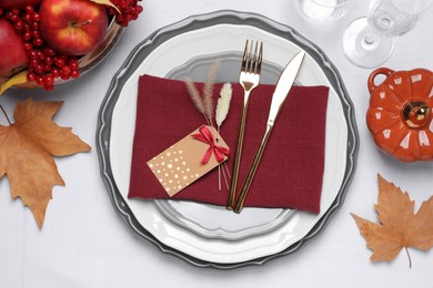 Elegant festive setting with autumn decor on table, flat lay