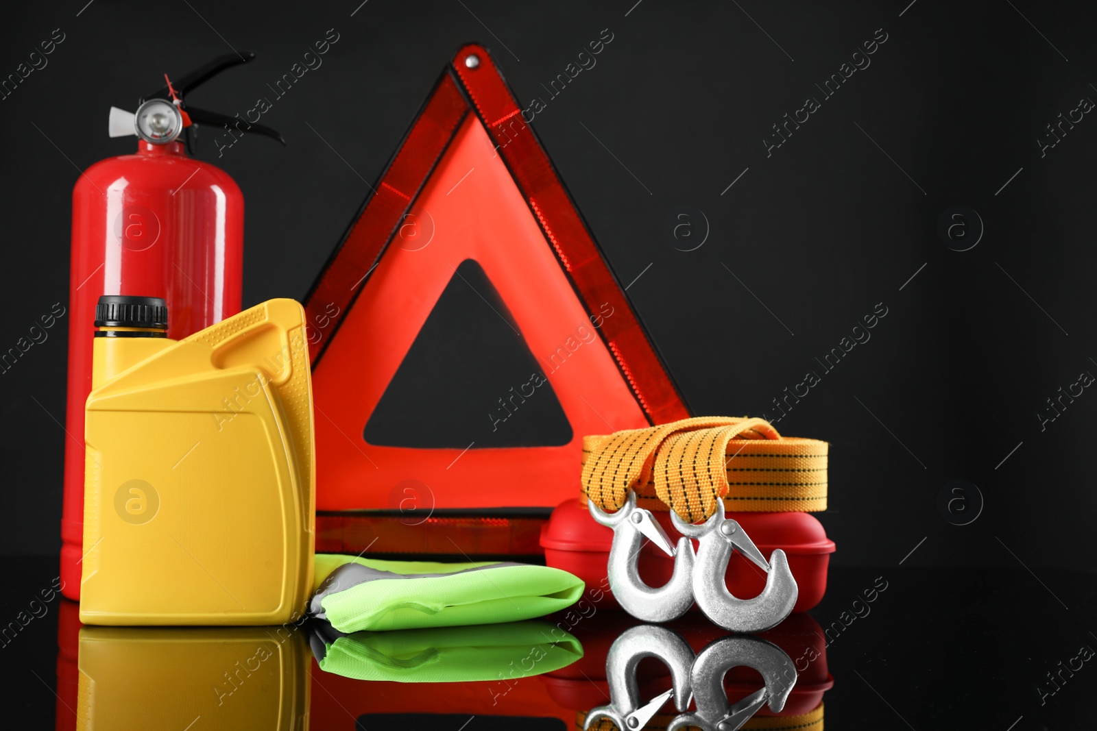 Photo of Set of car safety equipment on black background