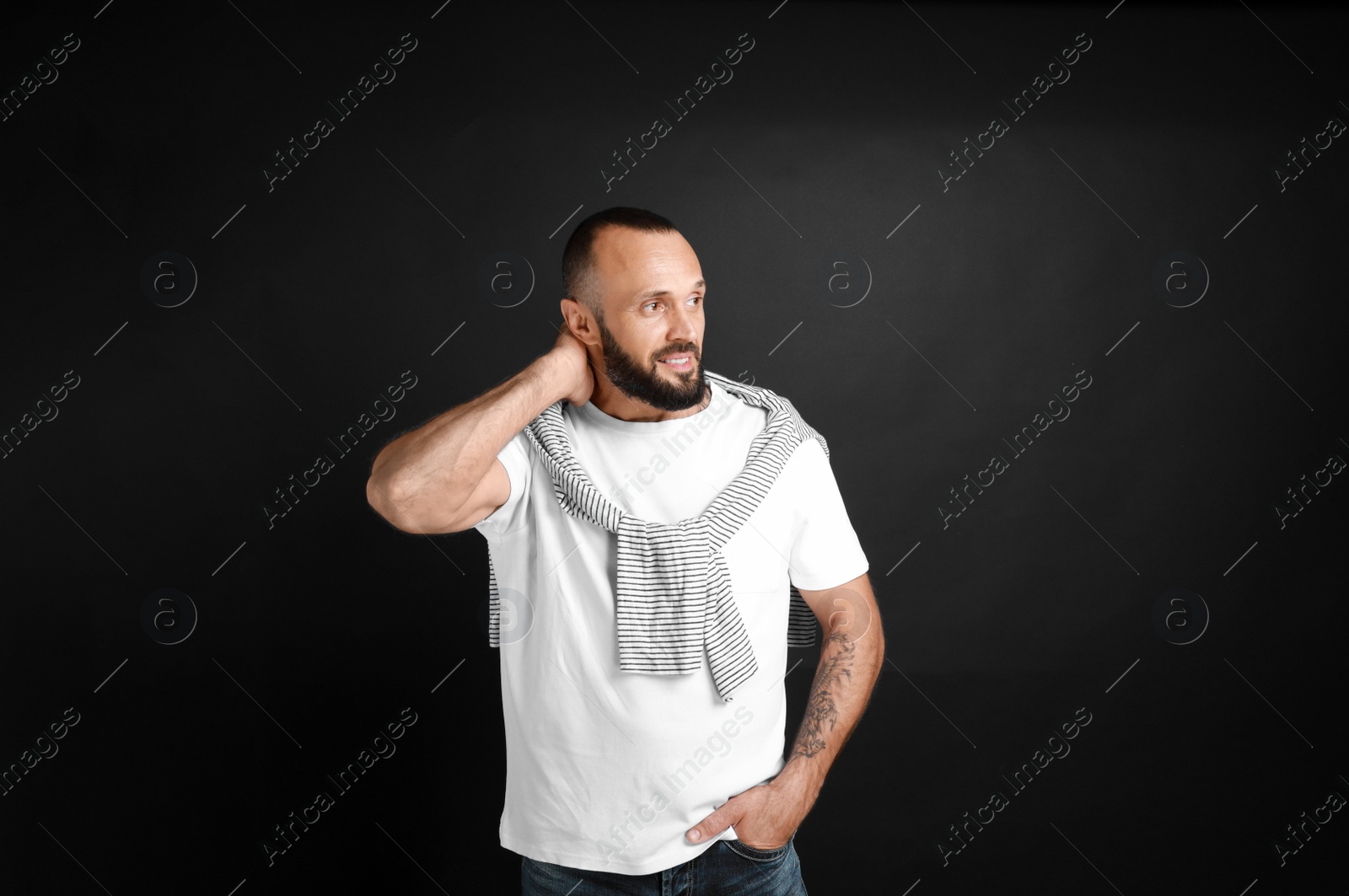 Photo of Portrait of handsome man on black background