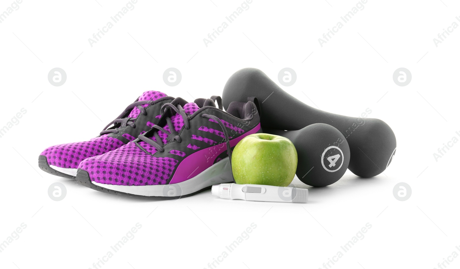 Photo of Lancet pen, dumbbells, apple and sneakers on white background. Diabetes concept