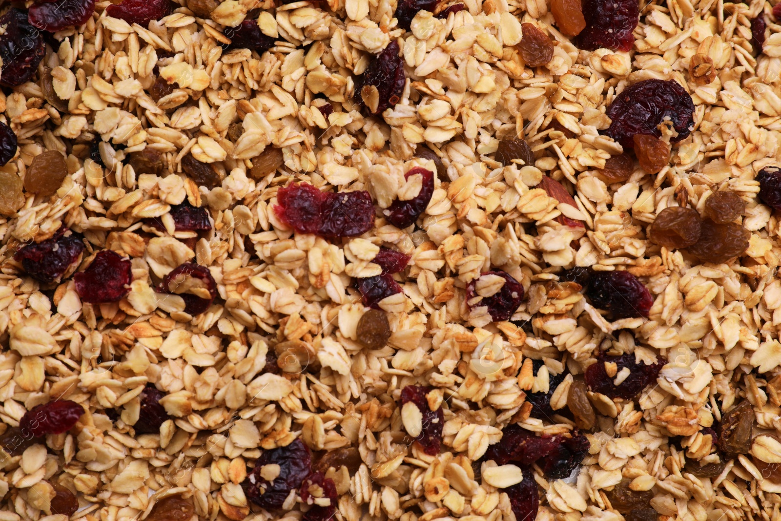Photo of Sweet tasty granola as background, top view