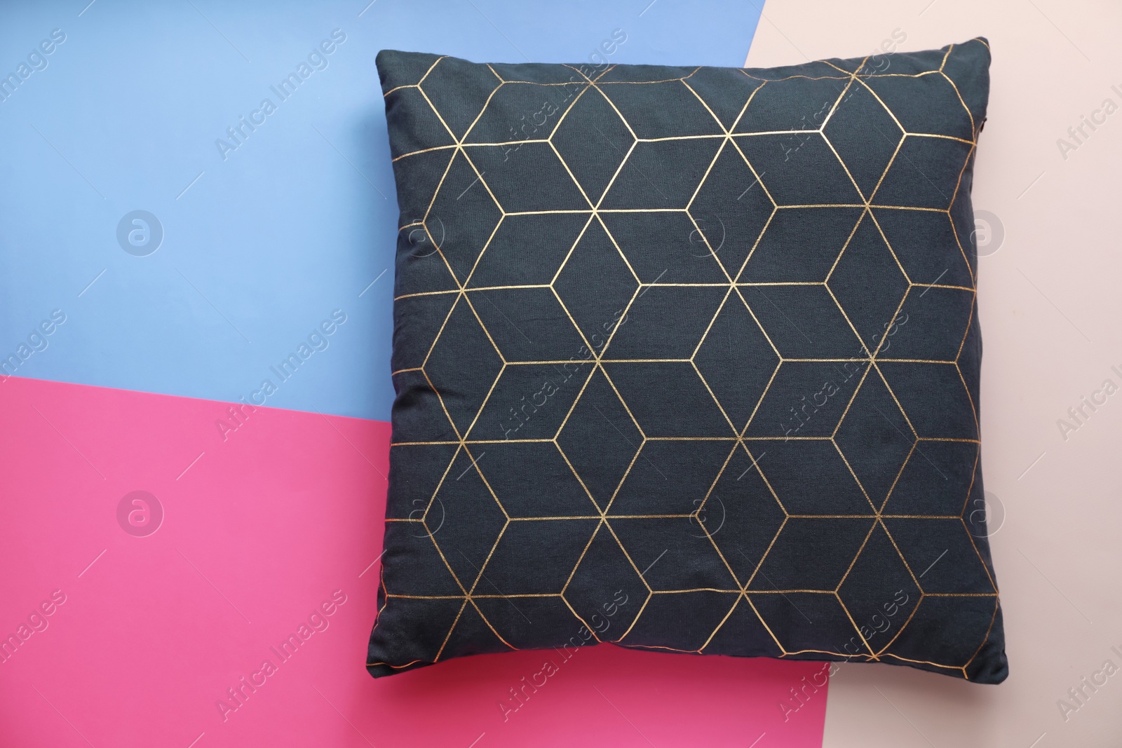 Photo of Soft decorative pillow on color background, top view