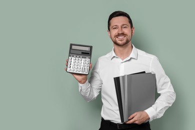 Happy accountant with calculator and folders on olive background. Space for text