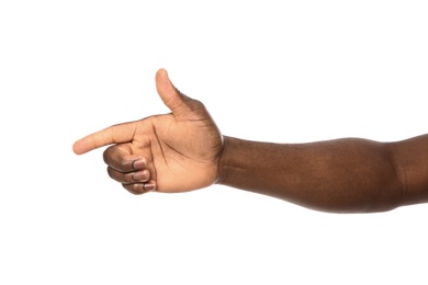 African-American man pointing at something on white background, closeup