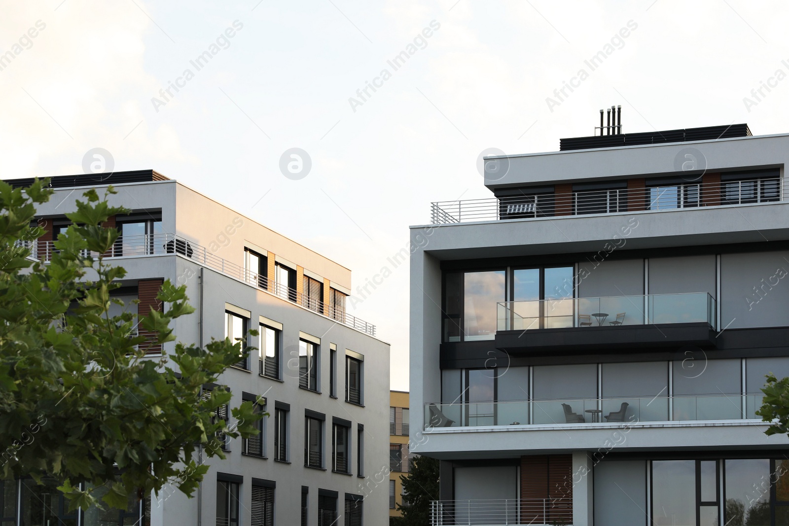 Photo of Beautiful view of modern buildings with big windows outdoors