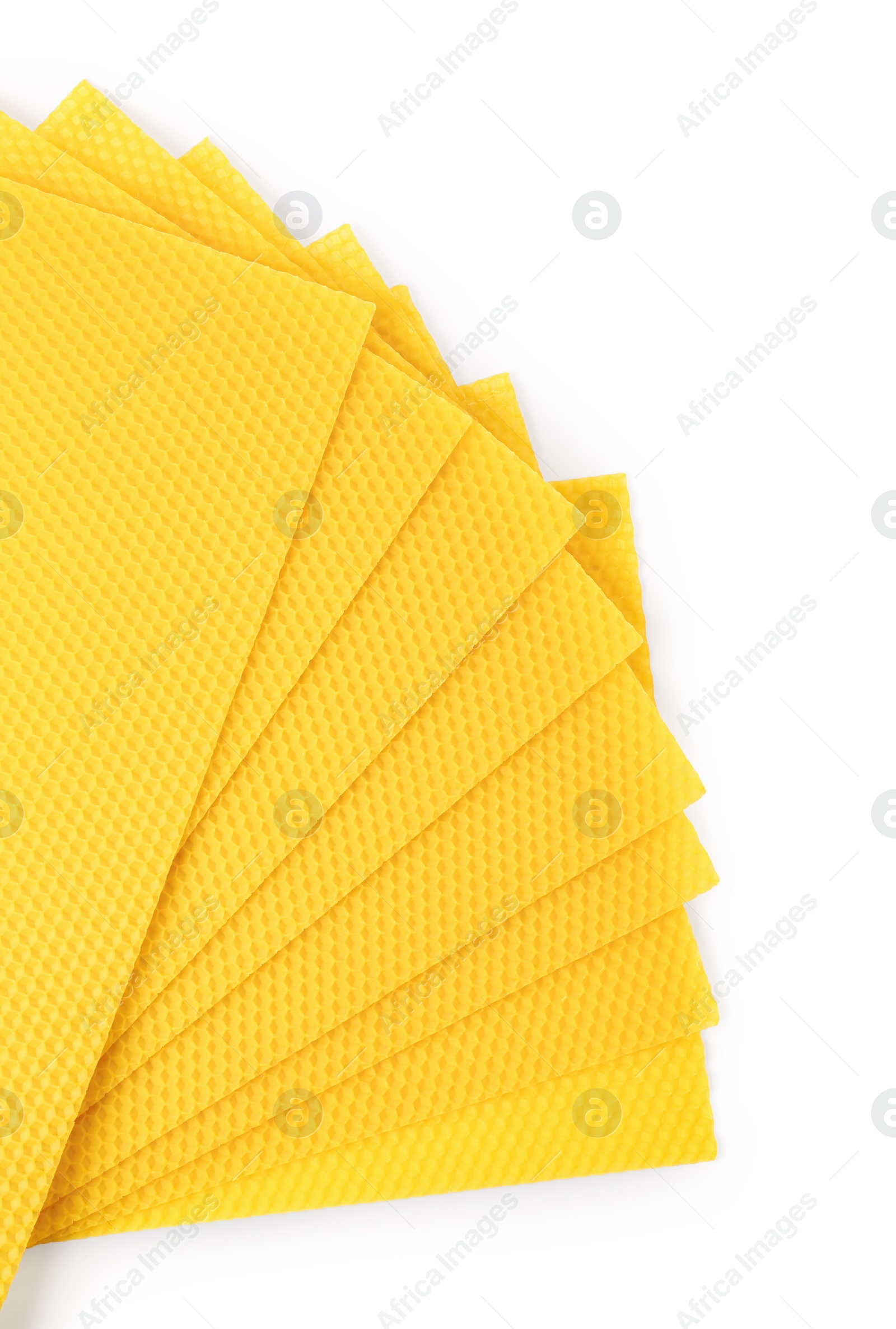 Photo of Natural organic beeswax sheets on white background, top view