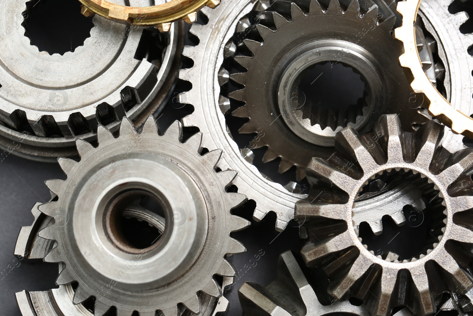 Photo of Many different stainless steel gears as background, top view