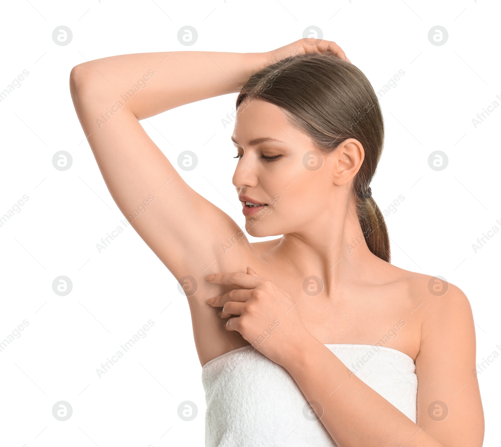 Photo of Young beautiful woman showing armpit with smooth clean skin on white background