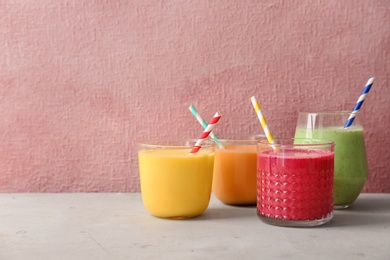 Photo of Glasses with delicious detox smoothies on table