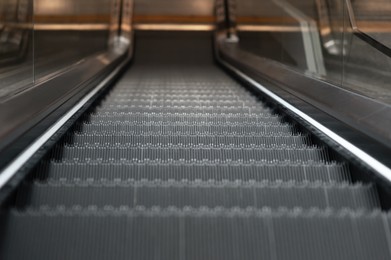 Photo of Closeup view of escalator in airport terminal