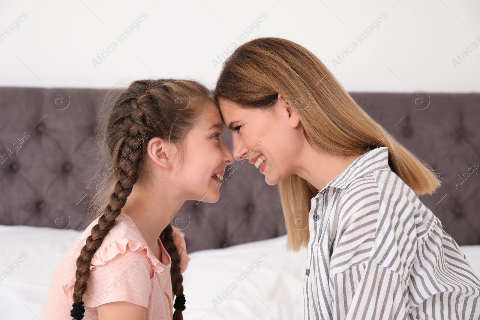 Photo of Mother with cute child in bedroom. Happy family