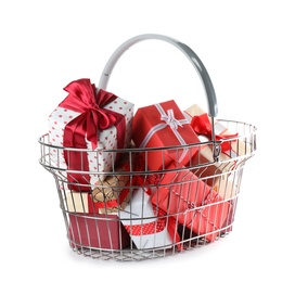 Photo of Shopping basket full of gift boxes on white background