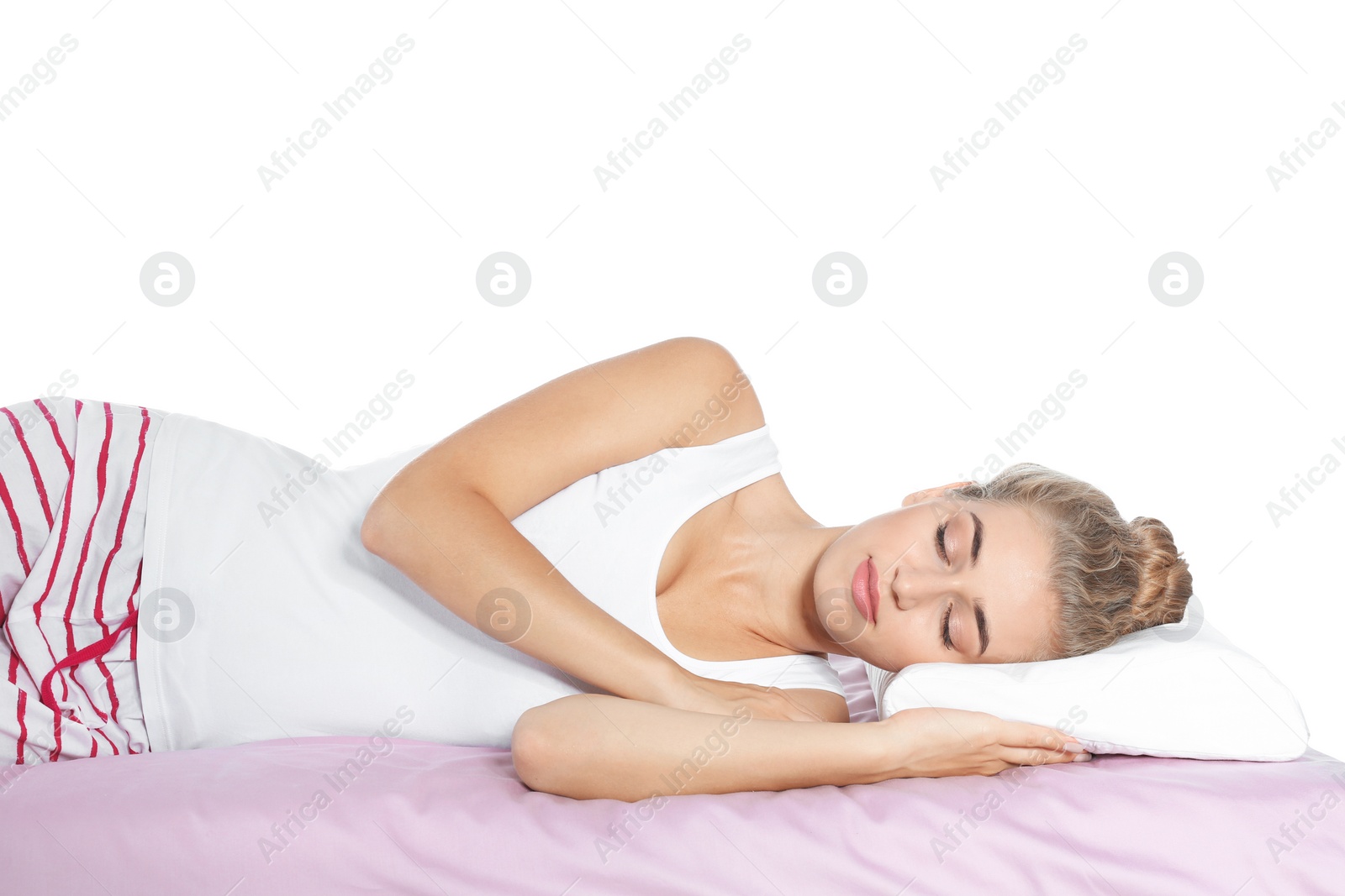 Photo of Beautiful woman sleeping with orthopedic pillow on bed against white background