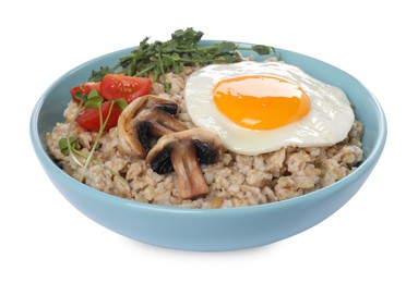 Photo of Tasty boiled oatmeal with fried egg, mushrooms and tomatoes isolated on white