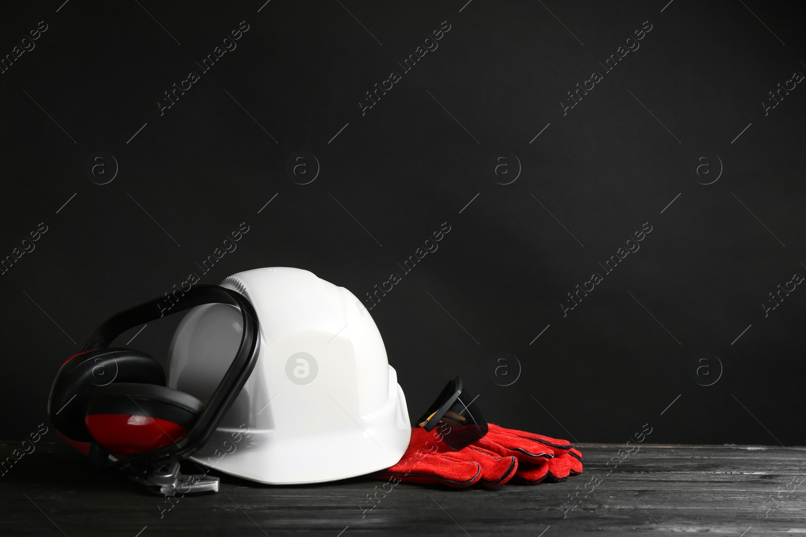 Photo of Composition with safety equipment on table. Space for text