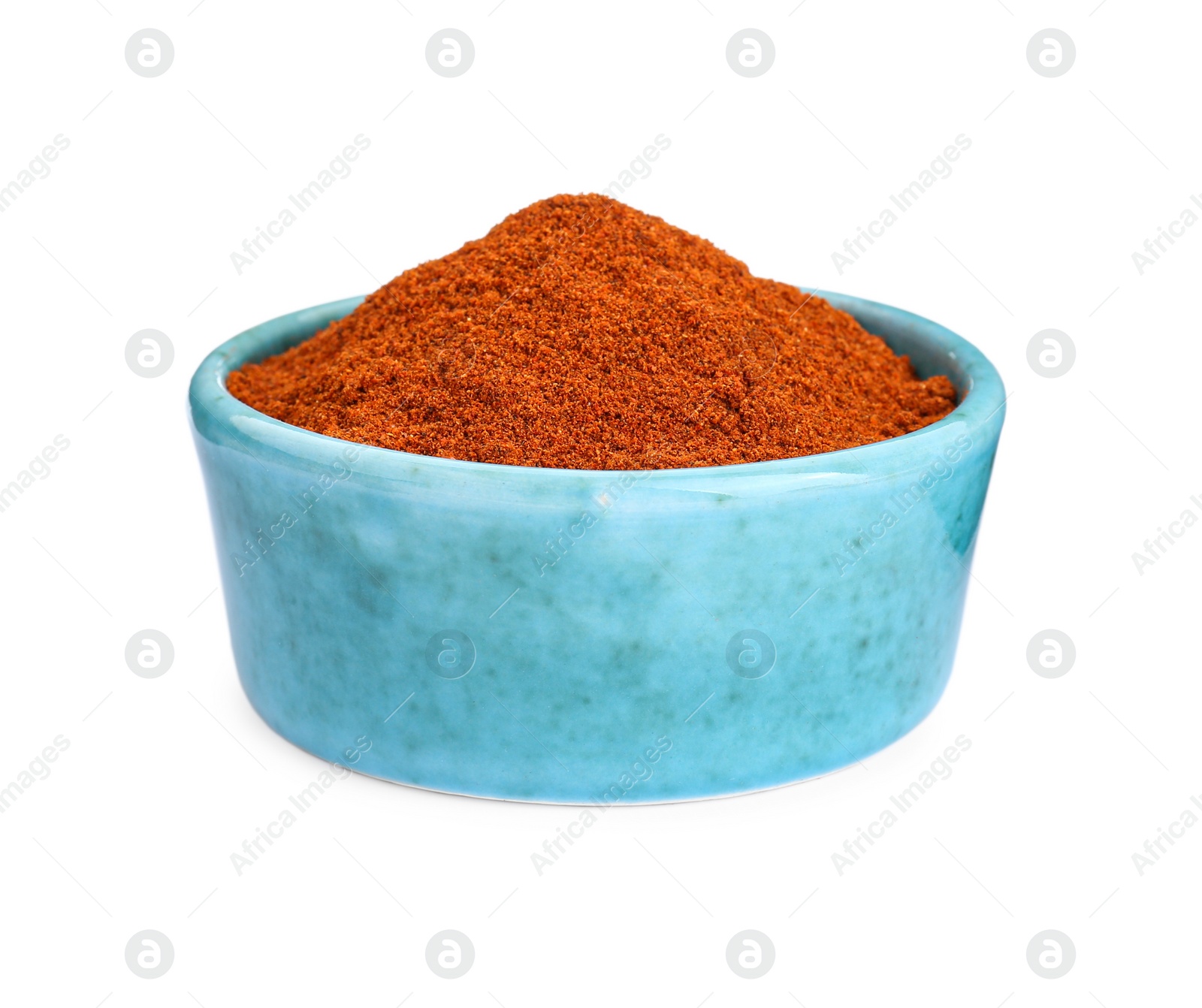 Photo of Bowl with aromatic paprika powder isolated on white