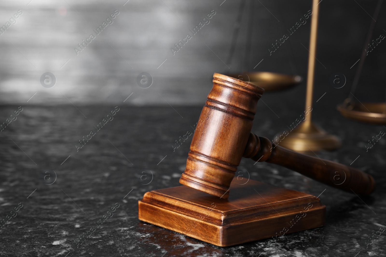 Photo of Law concept. Judge's gavel on dark textured table, space for text