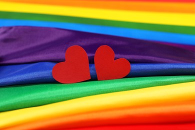 Photo of Hearts on rainbow LGBT flag, closeup view