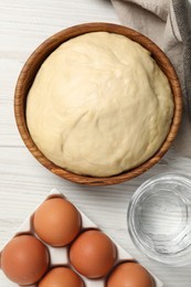 Photo of Cooking scones with soda water. Dough and ingredients on white wooden table, flat lay