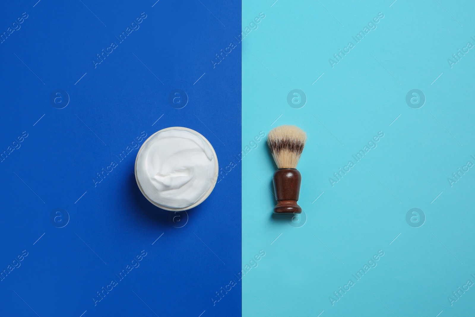 Photo of Flat lay composition with shaving brush and cream on color background