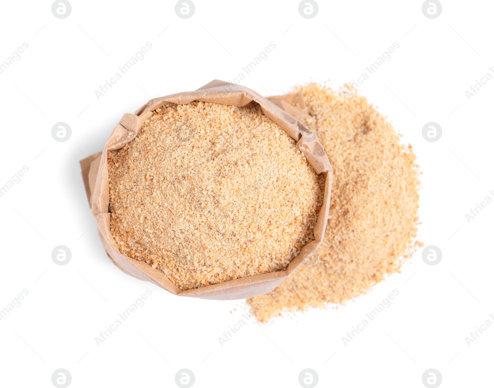 Photo of Fresh bread crumbs and paper bag on white background, top view