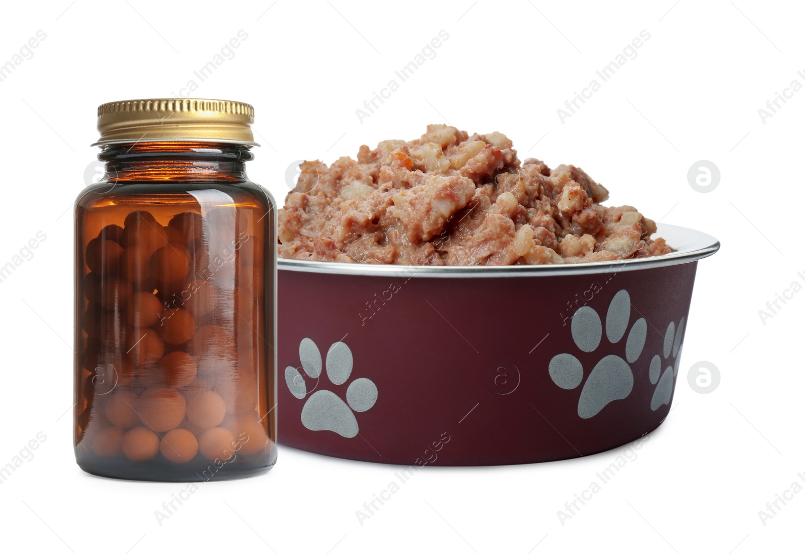 Image of Wet pet food in feeding bowl and bottle with vitamin pills on white background