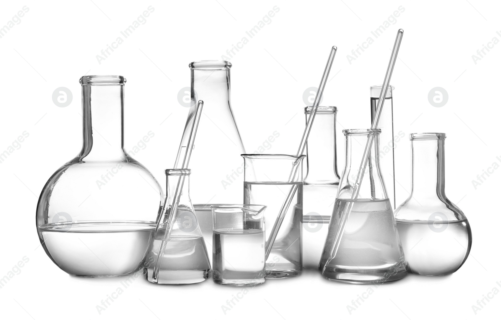 Photo of Glassware with liquids isolated on white. Laboratory analysis