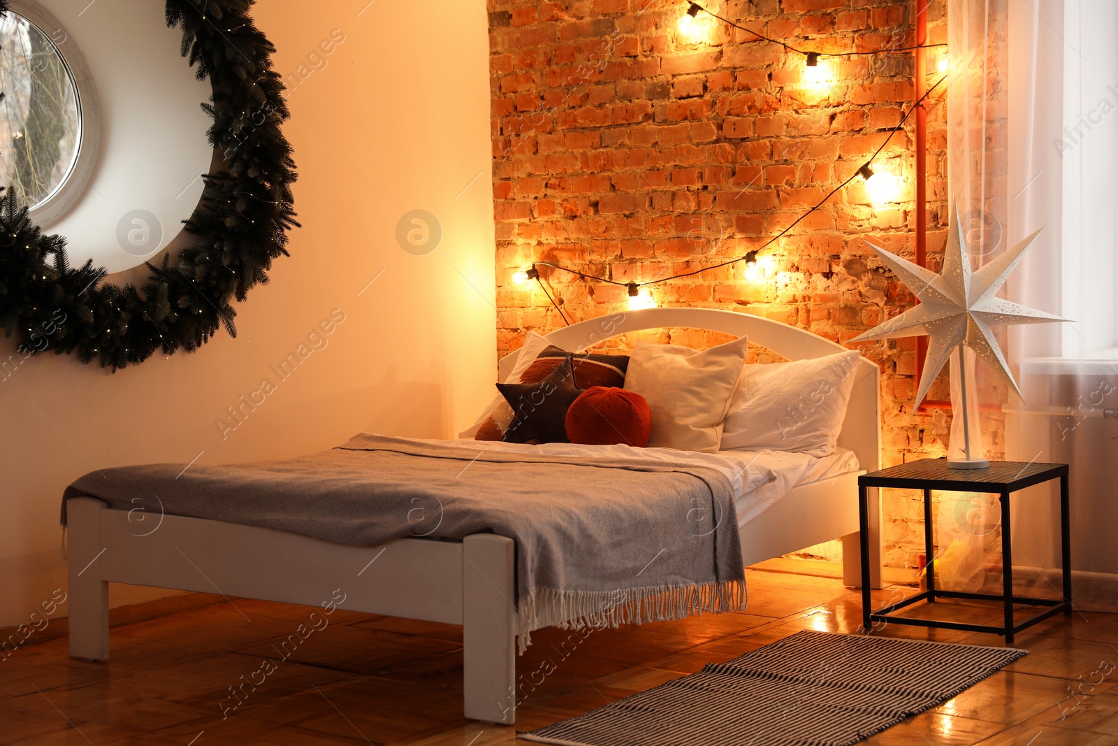 Photo of Cozy bedroom with stylish Christmas decor. Interior design