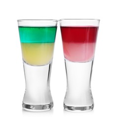 Photo of Different shooters in shot glasses isolated on white. Alcohol drink